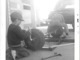 1968 May - Paul & Dad fixing cars.jpg